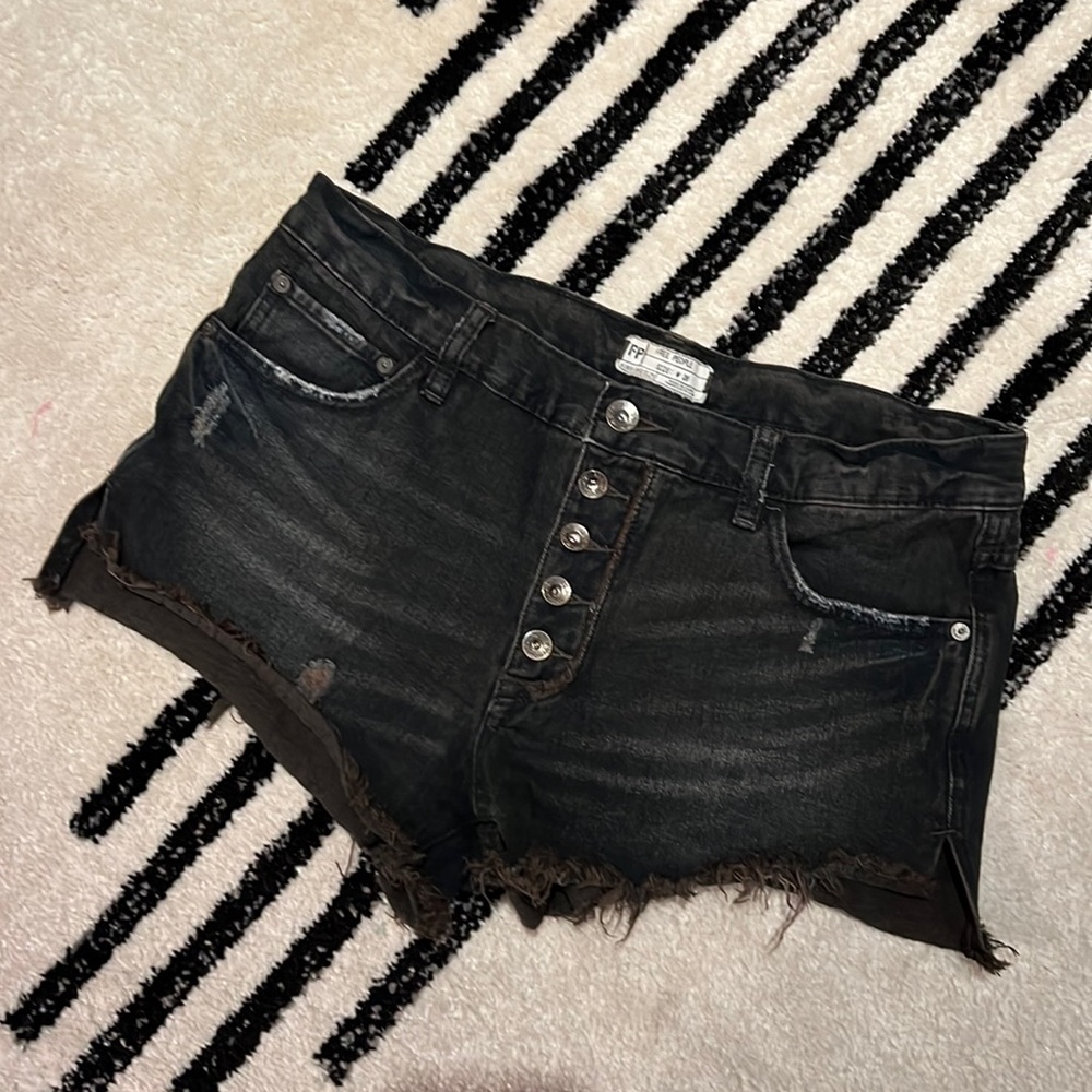 Free people distressed black jean shorts